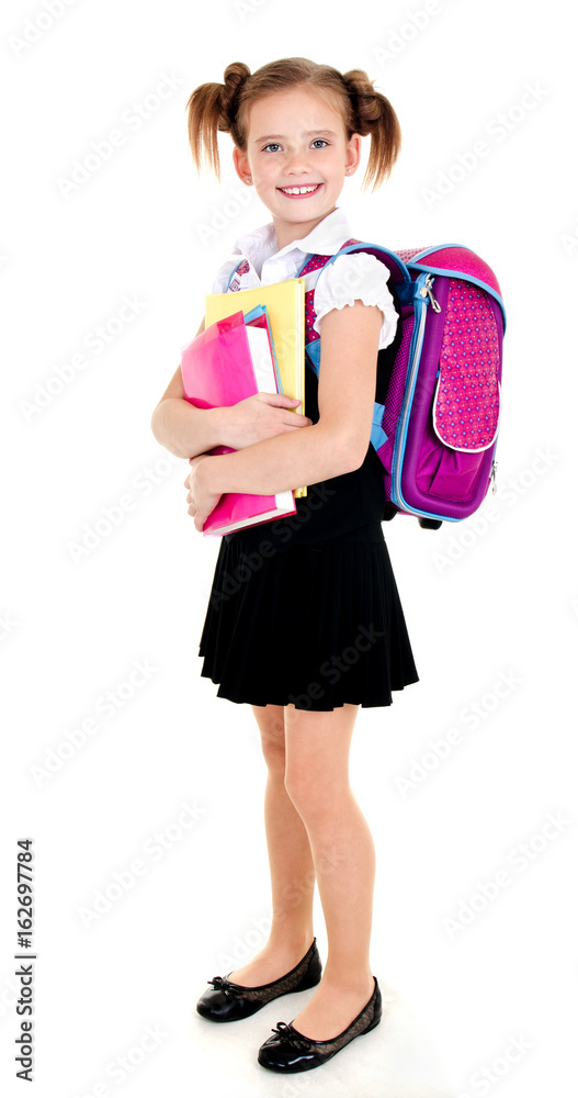Portrait of smiling school girl child with backpack and books in uniform isolated