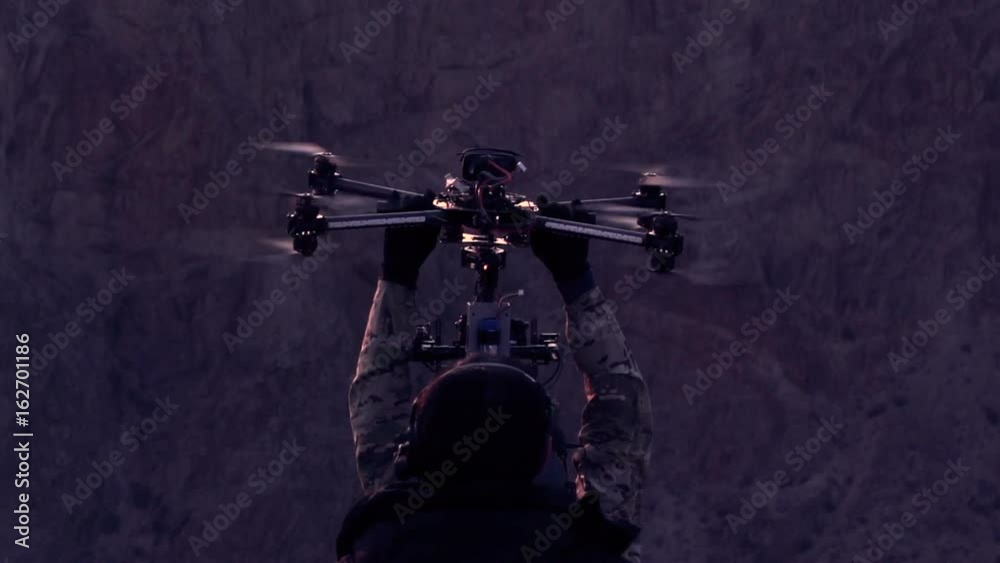 Operators of the Research UAV. The drone slowly descends into the hands of the orator after a night exploratory flight