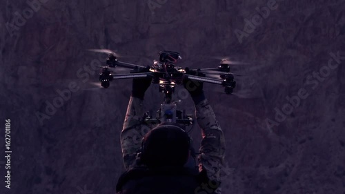 Operators of the Research UAV. The drone slowly descends into the hands of the orator after a night exploratory flight