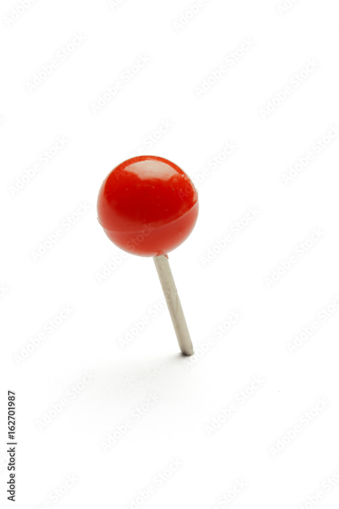 close up of a pushpin on white background close up of a pushpin on white background