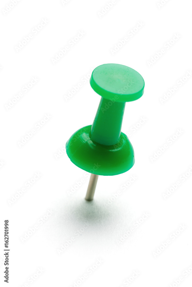 close up of a pushpin on white background