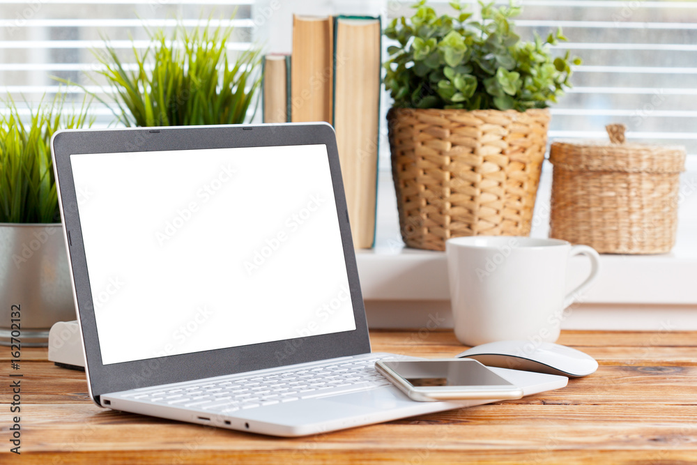 Work space. laptop blank screen on wooden table. Work space. laptop blank screen on wooden table.