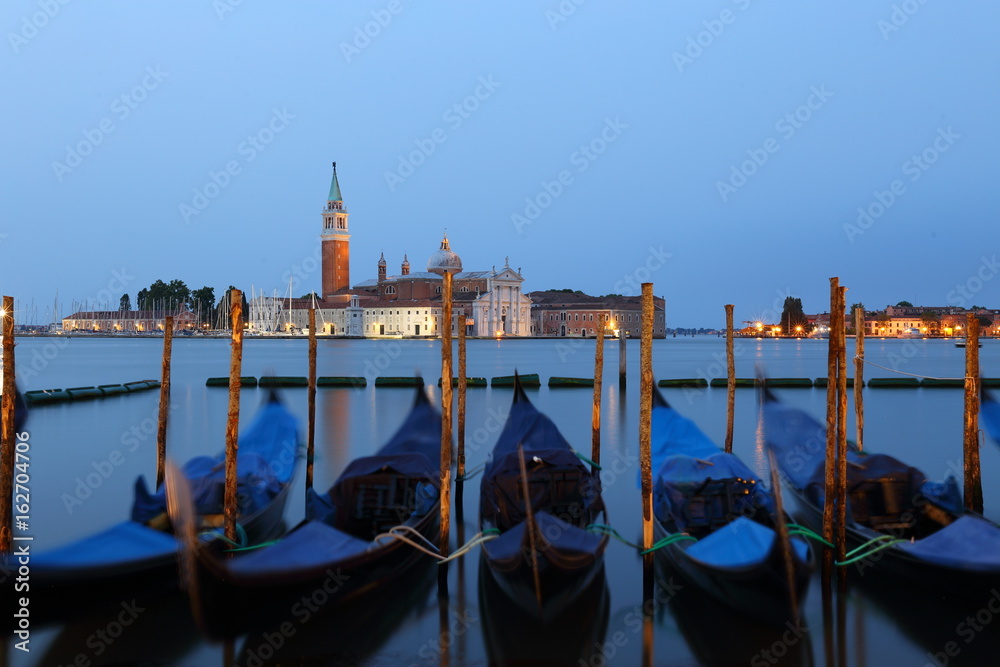 Gondolas and Chiesa di San Giorgio Maggiore, San Marco square in Venice, Italy