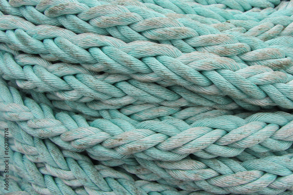 Light-blue sea hemp rope, background, close-up Light-blue sea hemp rope, background, close-up