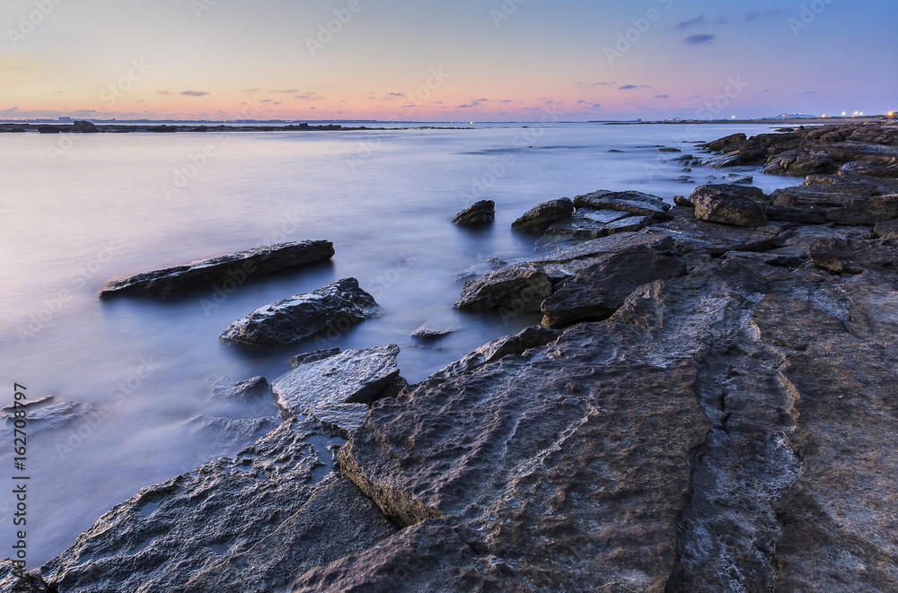 Sunrise on the wild beach of the Caspian Sea coast near Baku Sunrise on the wild beach of the Caspian Sea coast near Baku