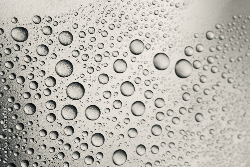 Raindrops on silver surface Raindrops on silver surface
