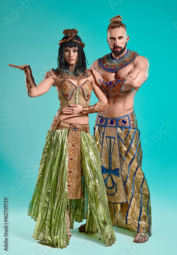 The man, woman in the images of Egyptian Pharaoh and Cleopatra