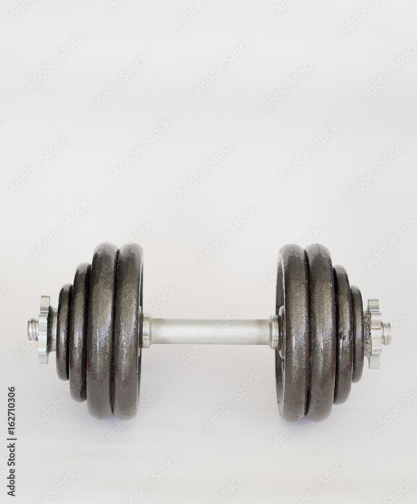 Naklejka premium Fitness equipment and accessories with dumbbells.Fitness concept.