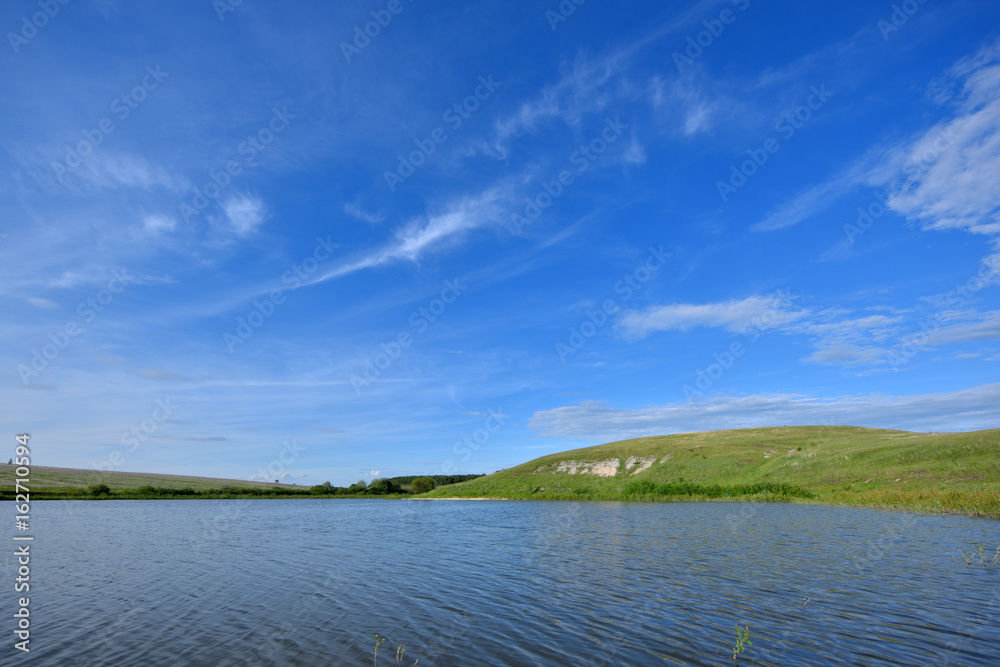 Beautiful scenery with water, hills and forest Beautiful scenery with water, hills and forest