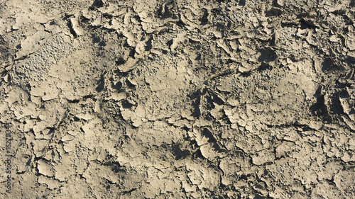 Cracked surface of the earth. The result of drought on the soil.
