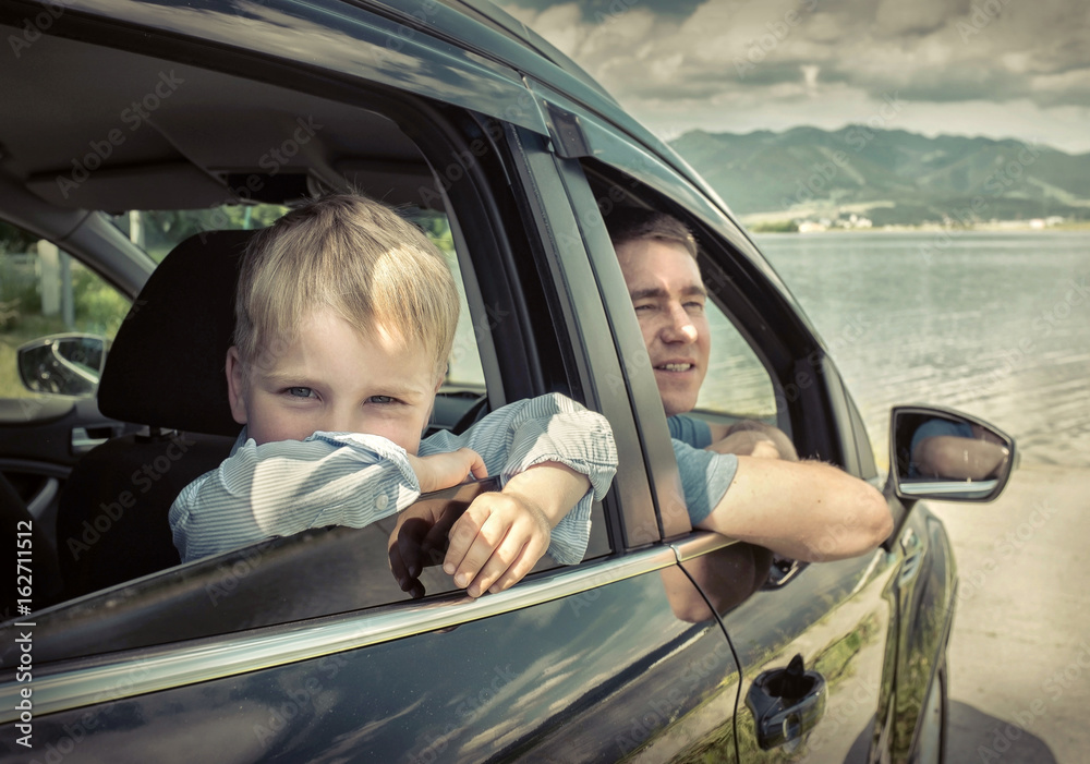 Father and son sitting in car Father and son sitting in car