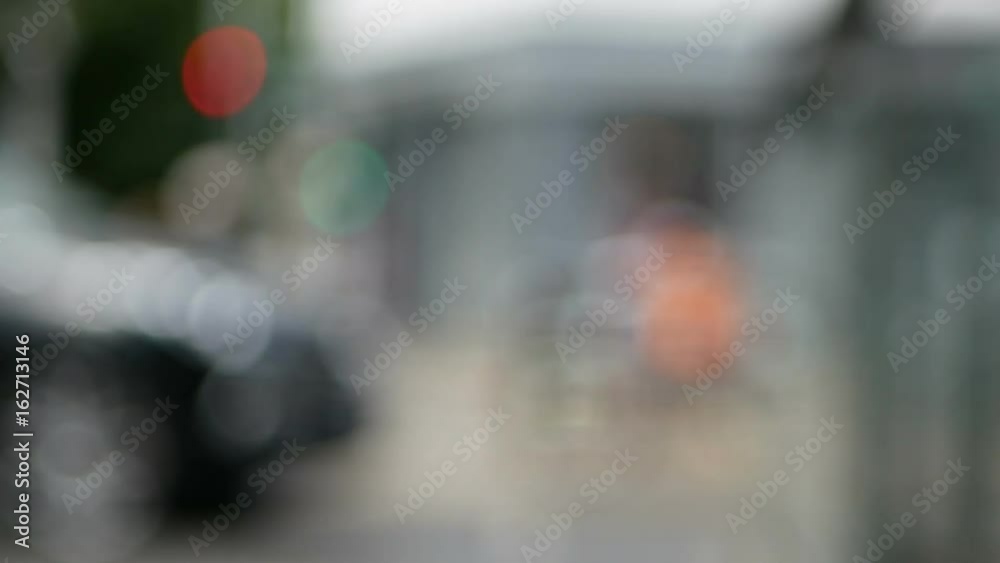 Blurred afternoon traffic - Cars, tourists and pedestrians Blurred afternoon traffic - Cars, tourists and pedestrians