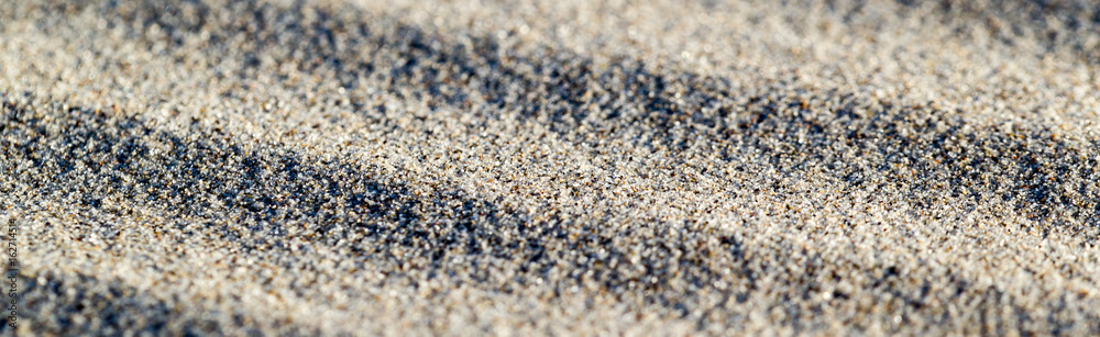 Lines in the sand of a beach. Sand texture. Long banner Lines in the sand of a beach. Sand texture. Long banner