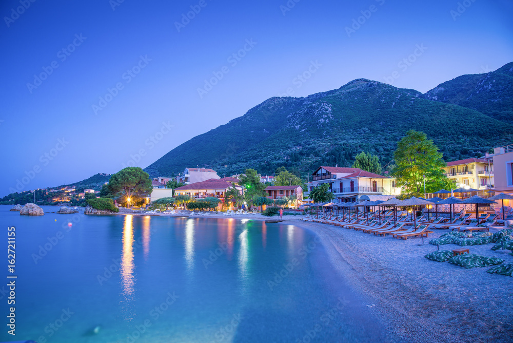 Beautiful night scene over the beach and traditional architecture of Nikiana village, in Lefkada, Greece