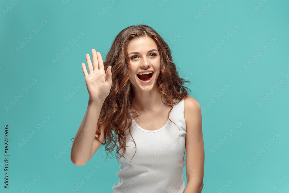 The young woman's portrait with happy emotions The young woman's portrait with happy emotions