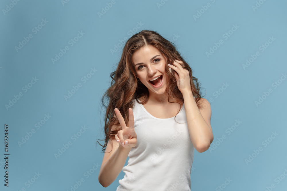 The young woman's portrait with happy emotions The young woman's portrait with happy emotions