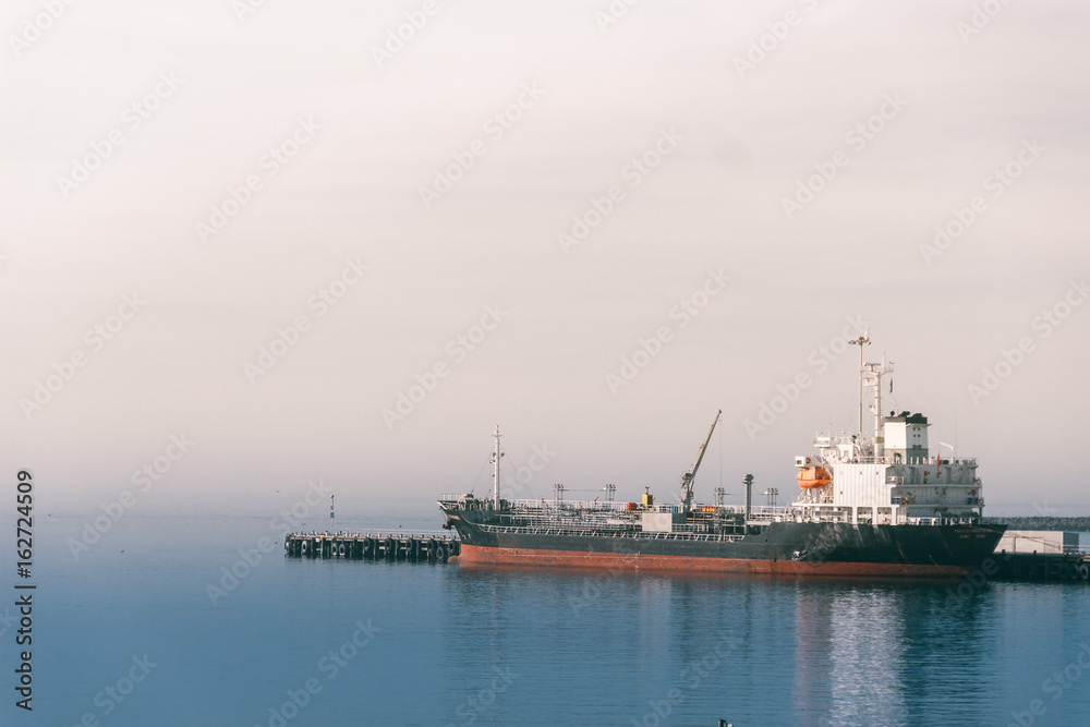 Ship in the port in the fog