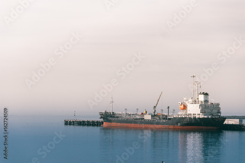 Ship in the port in the fog