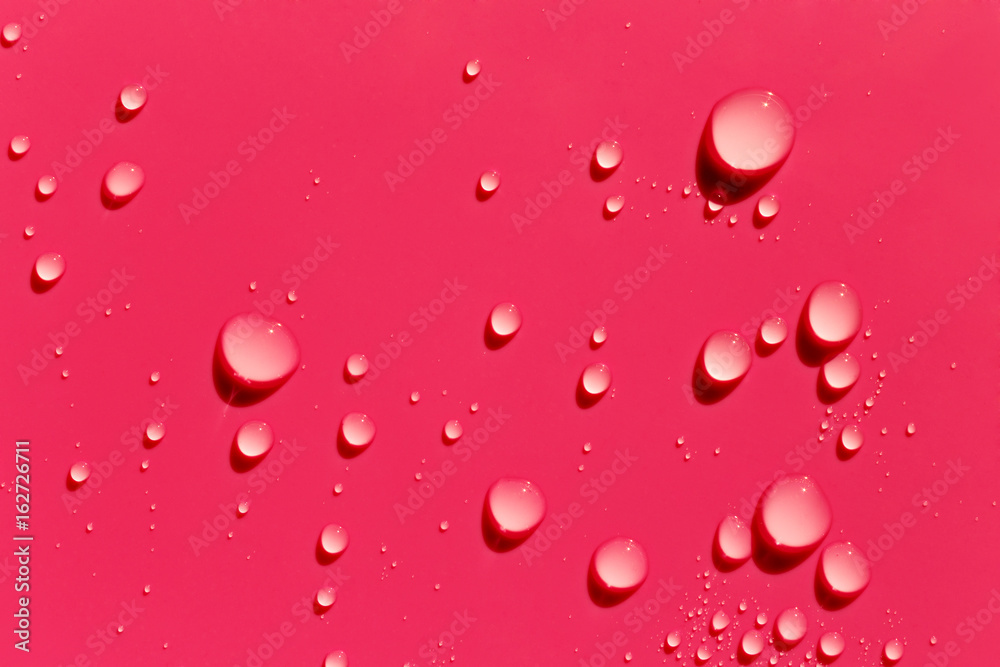 Red abstract background, water drops