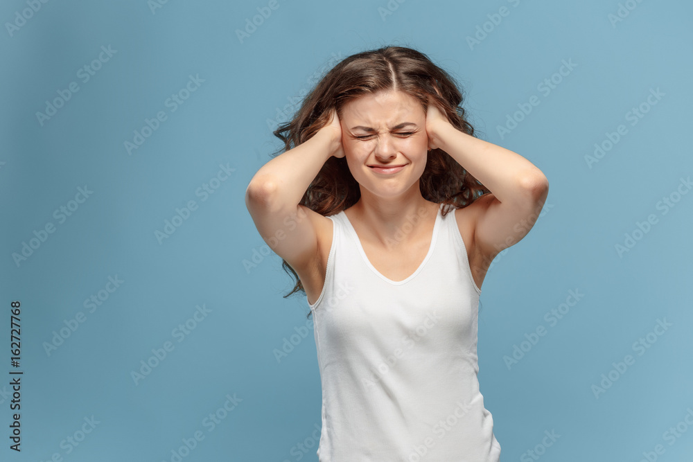 The young woman's portrait with pain emotions The young woman's portrait with pain emotions