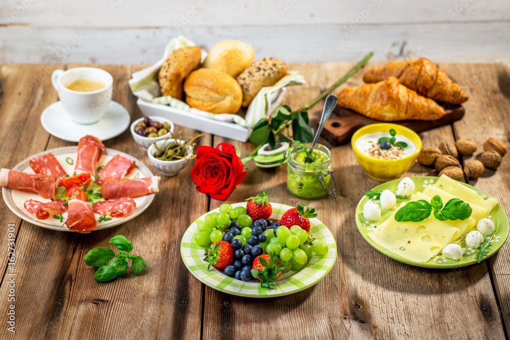 Breakfast served with fruit, croissants,cheese and sausage Breakfast served with fruit, croissants,cheese and sausage