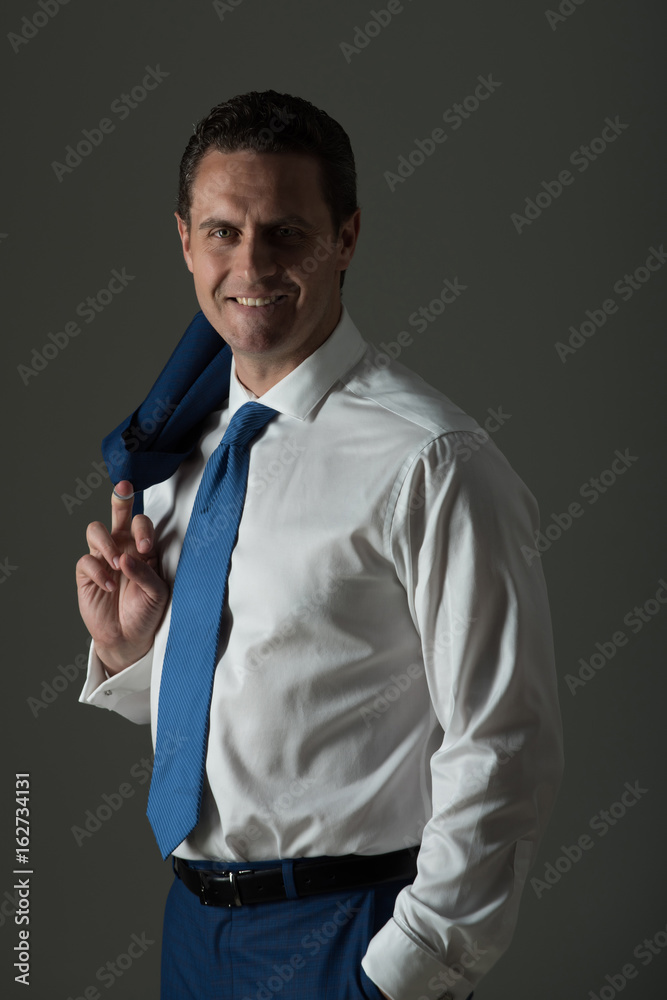 Happy man smiling in fashionable white shirt Happy man smiling in fashionable white shirt
