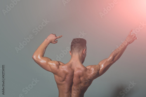 Fototapeta Naklejka Na Ścianę i Meble -  sexy man with muscular body and back