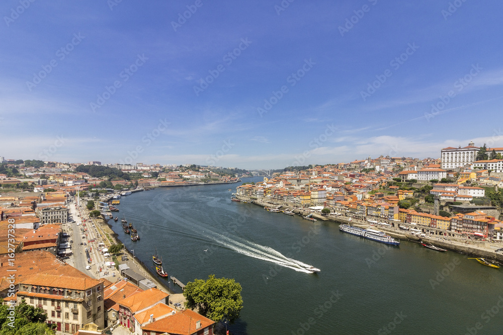 Panoramic view of old downtown, Porto Ribeira cityscape and tradicional Rabelo boats