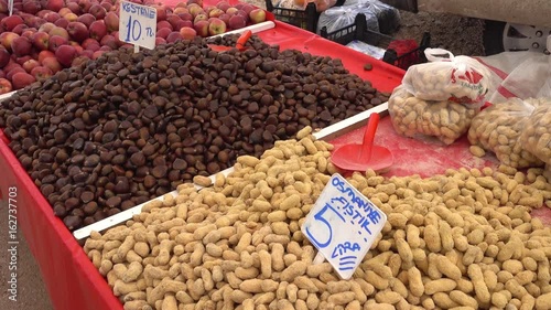 4K Sale of salted peanut in shell and chestnut photo