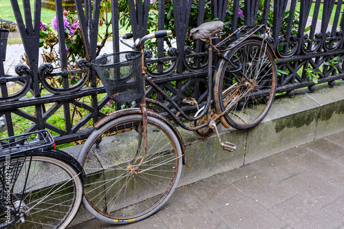 Old bicycle near the church fence