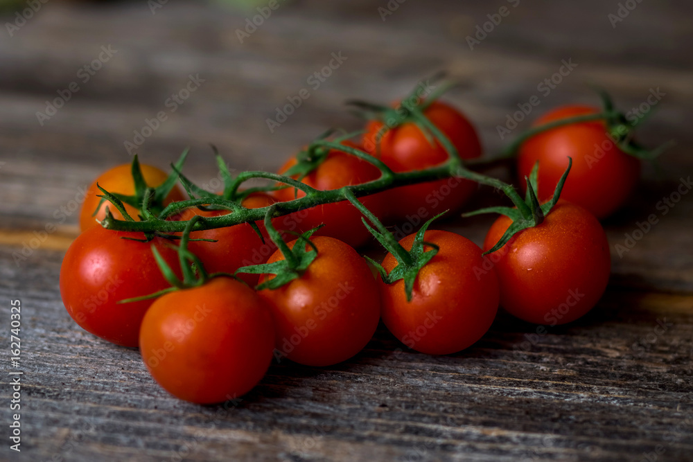 Cherry tomatoes on a wooden surface Cherry tomatoes on a wooden surface