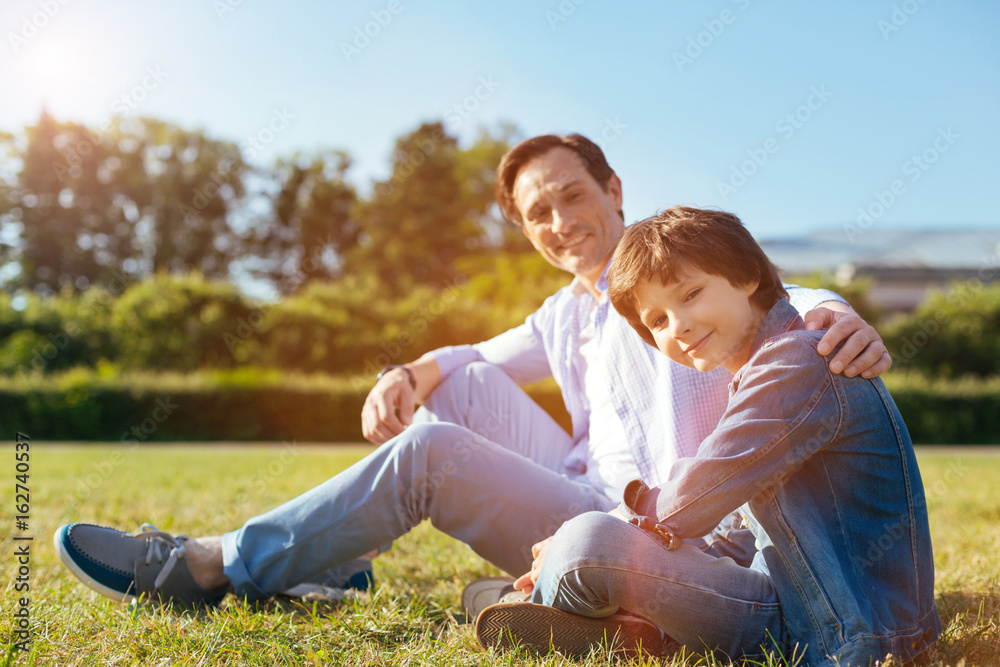 Lively positive child spending the day with his parent