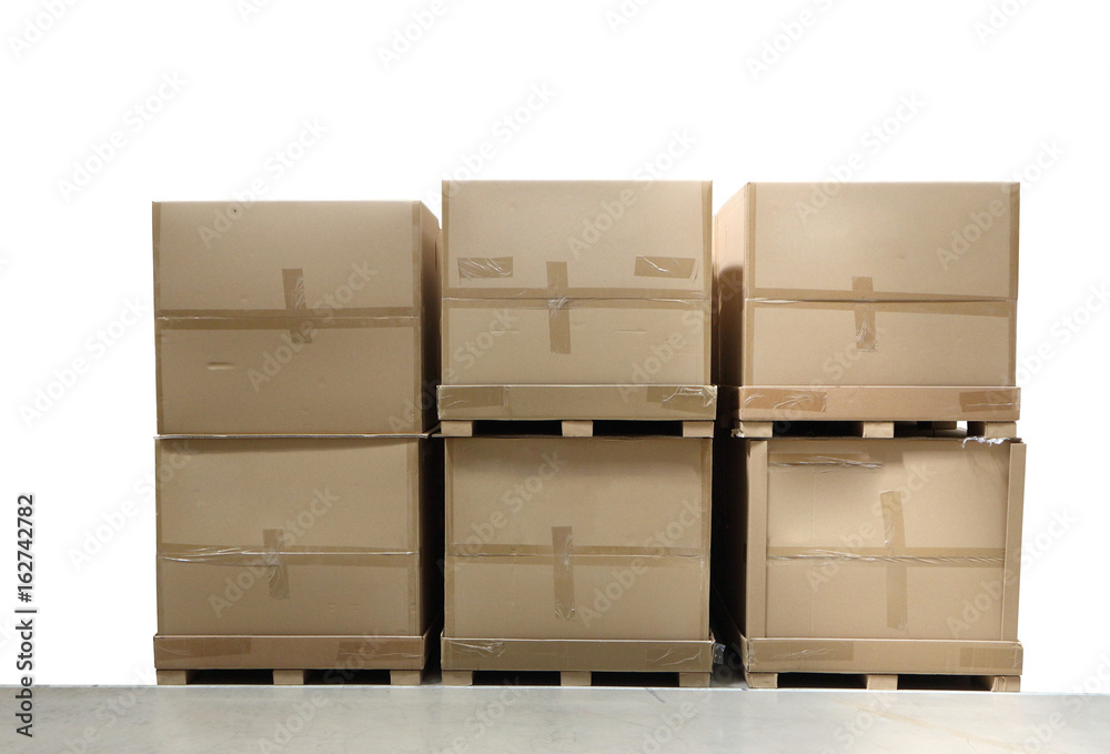 Cargo, delivery and transportation industry concept stacked cardboard boxes on wooden shipping pallet isolated on white background Cargo, delivery and transportation industry concept stacked cardboard boxes on wooden shipping pallet isolated on white background