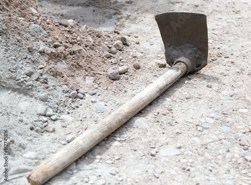 Shovel on a mixture of concrete at the construction site