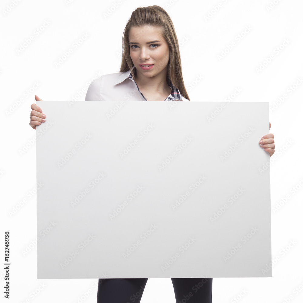 Young happy woman portrait of a confident businesswoman showing presentation, pointing placard gray background. Ideal for banners, registration forms, presentation, landings, presenting concept.. Young happy woman portrait of a confident businesswoman showing presentation, pointing placard gray background. Ideal for banners, registration forms, presentation, landings, presenting concept..
