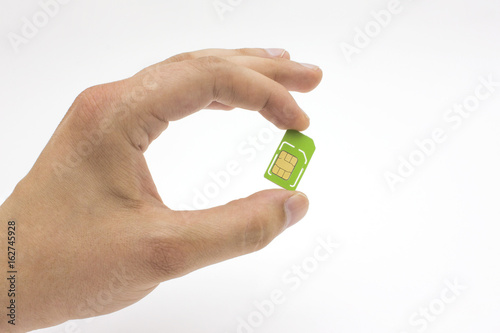 hand holding sim card over white background