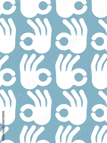 Okay hand sign seamless pattern. Positive consent symbol background