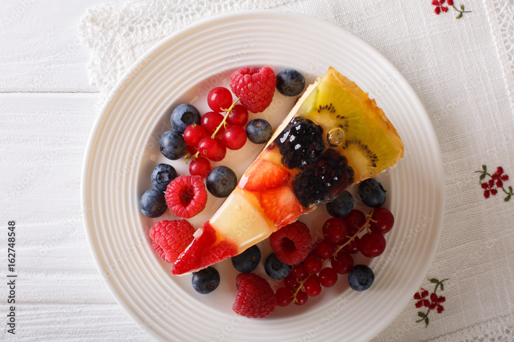 delicious piece of fruit cake jelly close-up on a plate. Horizontal top view delicious piece of fruit cake jelly close-up on a plate. Horizontal top view