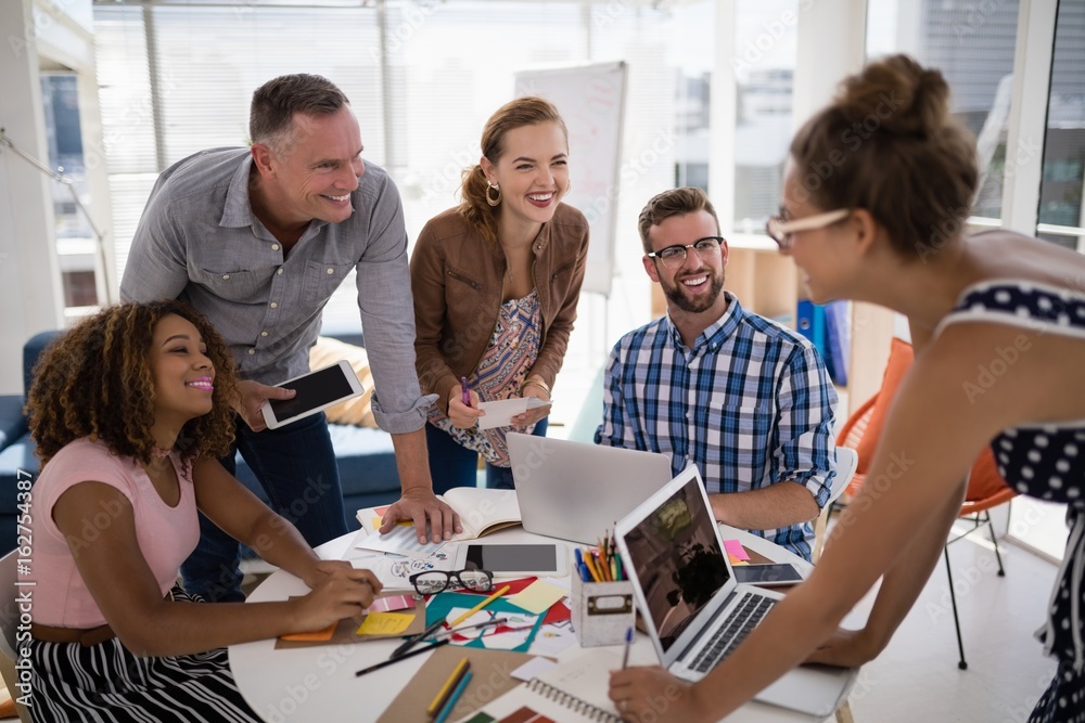 Team of executives working together in the office Team of executives working together in the office