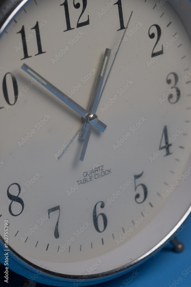 Fototapeta premium Closeup of hands on clock face. Time concept