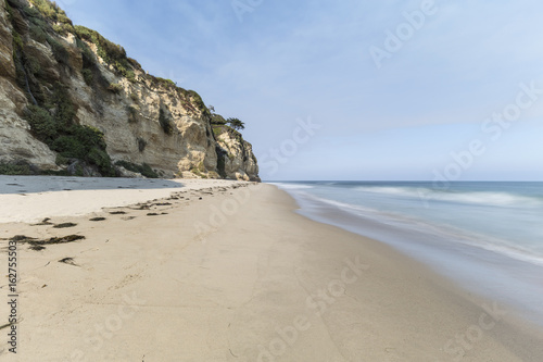Dume Cove beach with motion blur water in Malibu, California.