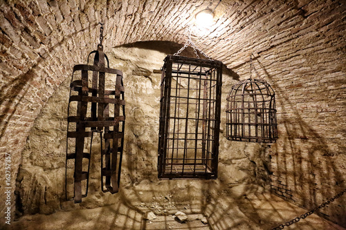 Medieval metal cages used for punisments photo