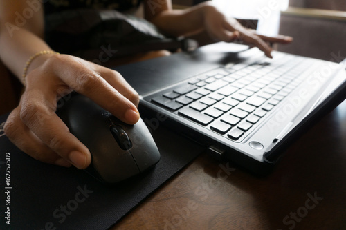 business women hand working with laptop © yanadhorn