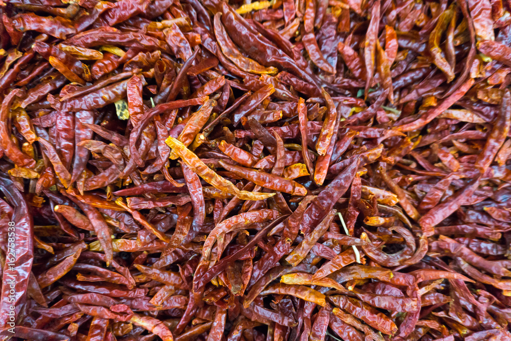 piles of dried red chilli in market piles of dried red chilli in market