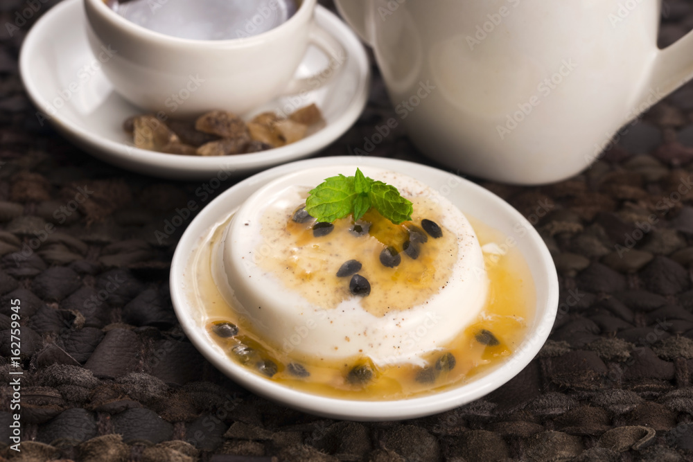 Panna cotta dessert with passion fruit and mint Panna cotta dessert with passion fruit and mint