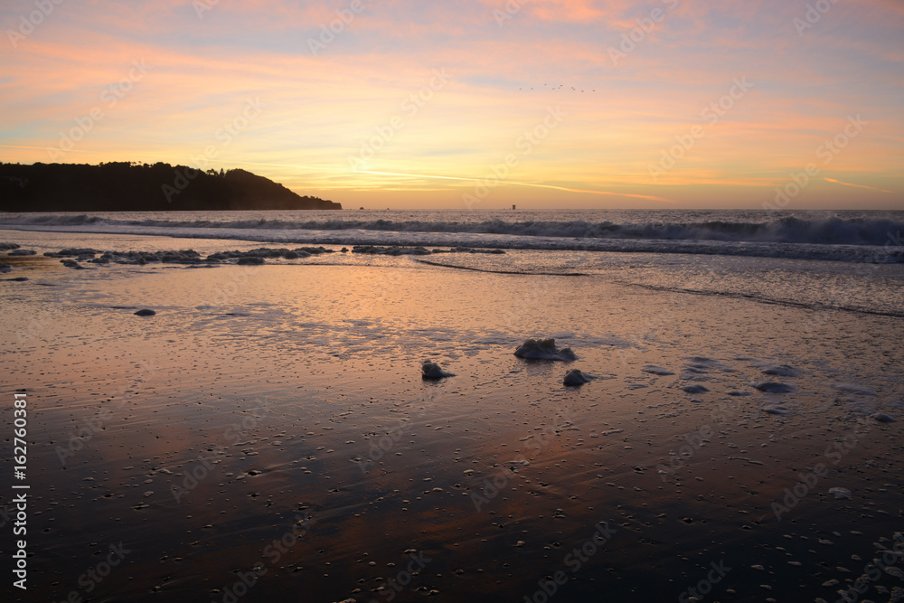 Fototapeta premium Sunset from Baker Beach in San Francisco California near Golden Gate Bridge