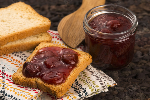 Breakfast of cherry jam on toast photo