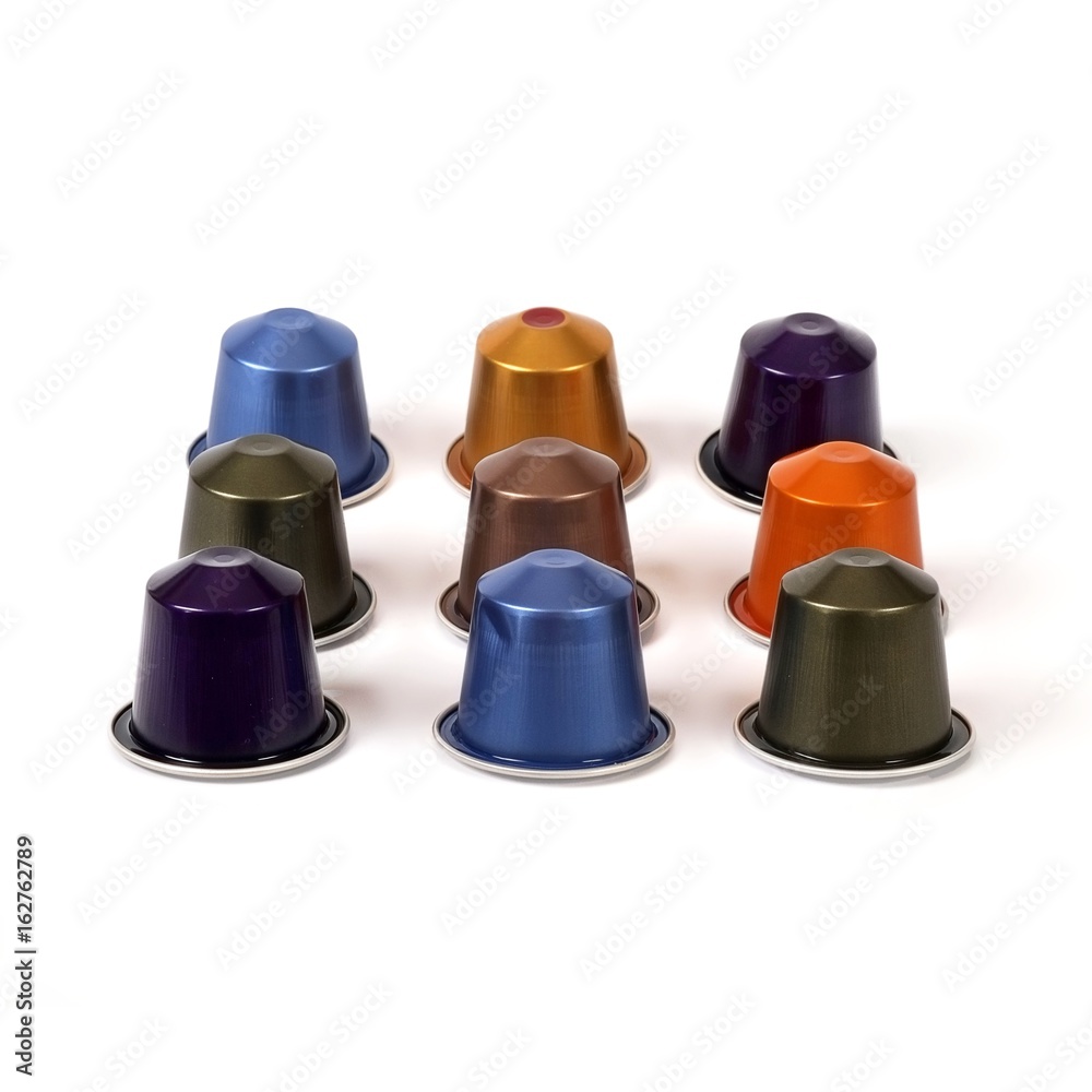Multi-colored capsules with strong coffee in various angles on a white background Multi-colored capsules with strong coffee in various angles on a white background