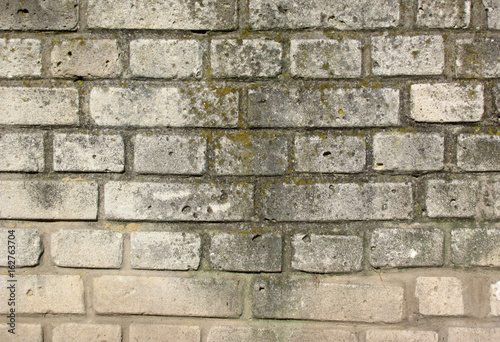 Rough gray brick wall, background, texture