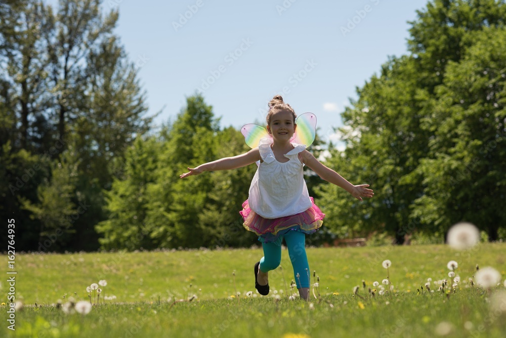 Excited girl running in park Excited girl running in park